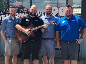 Guitar given to Cleveland Sanders.