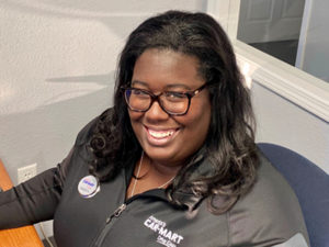 Jaqueeta Jones, Car-Mart Area Operations Manager, at her desk.