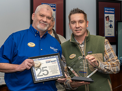 Steve Watson being presented his 25 years of service award by VPO Mike Rains.