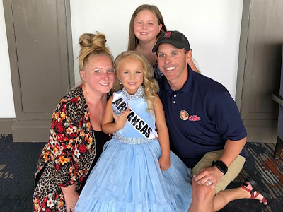 Trey with his wife and two daughters